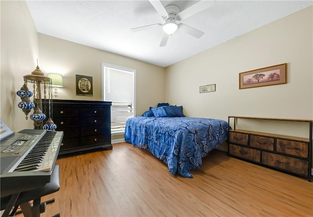 2306 Windsor Dr, Bryan, TX 77802 - bedroom with wood finished floors and ceiling fan
