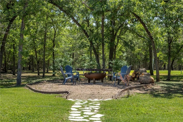 5249 Drake Dr, College Station, TX 77845 - view of play area with a lawn