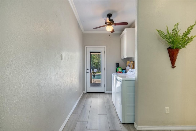 5249 Drake Dr, College Station, TX 77845 - laundry area featuring cabinet space, separate washer and dryer, ceiling fan, crown molding, and baseboards