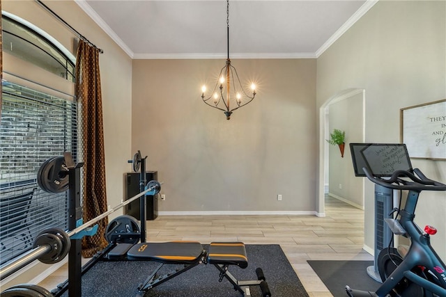 5249 Drake Dr, College Station, TX 77845 - exercise room featuring a chandelier, crown molding, wood finished floors, and baseboards