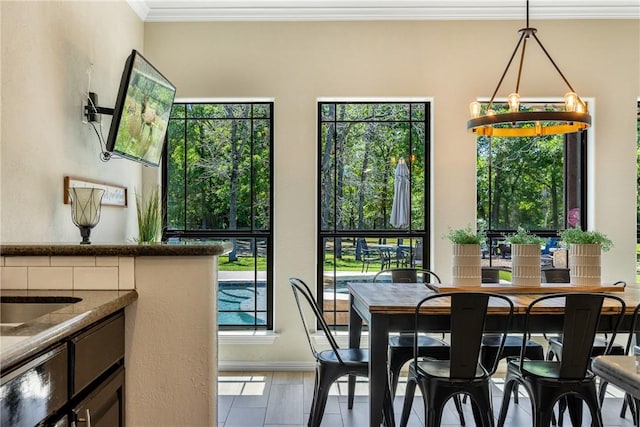 5249 Drake Dr, College Station, TX 77845 - tiled dining room featuring crown molding and baseboards