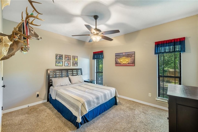 5249 Drake Dr, College Station, TX 77845 - bedroom featuring carpet, baseboards, and a ceiling fan