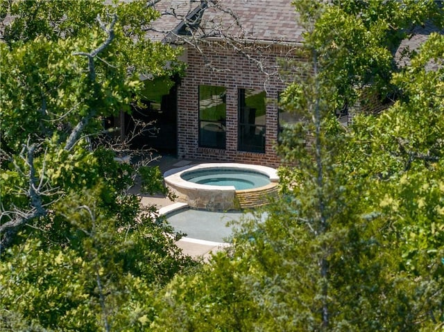 5249 Drake Dr, College Station, TX 77845 - view of swimming pool with an in-ground hot tub