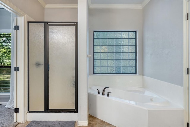 5249 Drake Dr, College Station, TX 77845 - bathroom featuring a shower stall, a garden tub, and ornamental molding