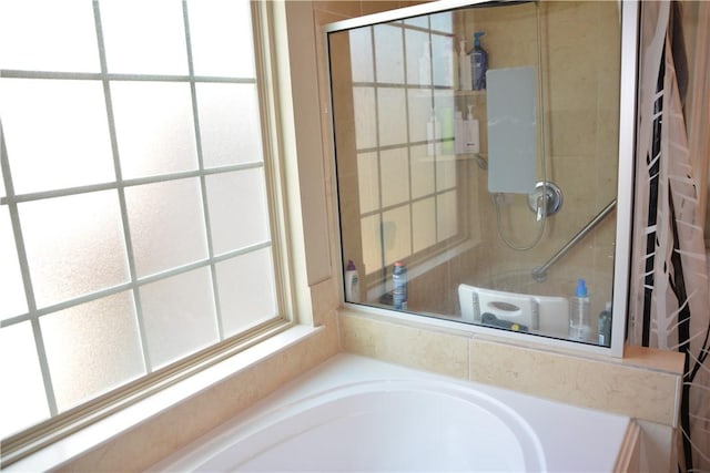 full bathroom with a tile shower and a garden tub