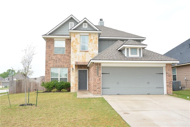 view of front of house featuring a garage, fence, a front yard, central AC unit, and driveway