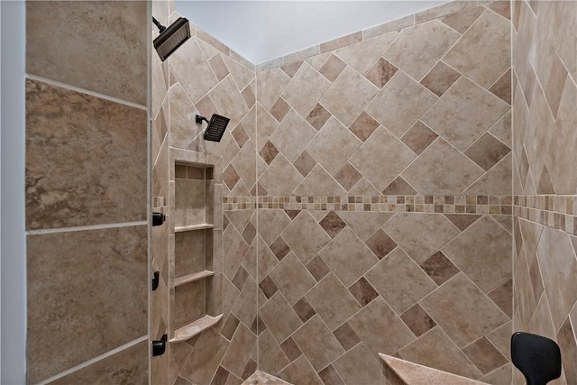 bathroom with tiled shower