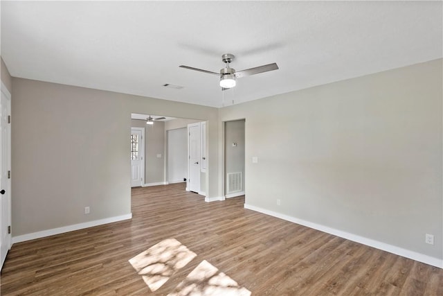 spare room featuring hardwood / wood-style floors and ceiling fan