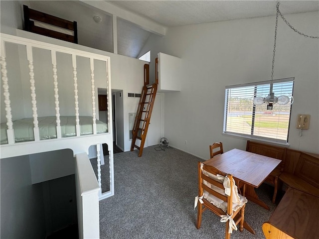 dining area featuring vaulted ceiling with beams and carpet floors