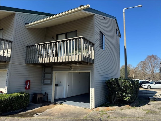 view of property exterior featuring a balcony