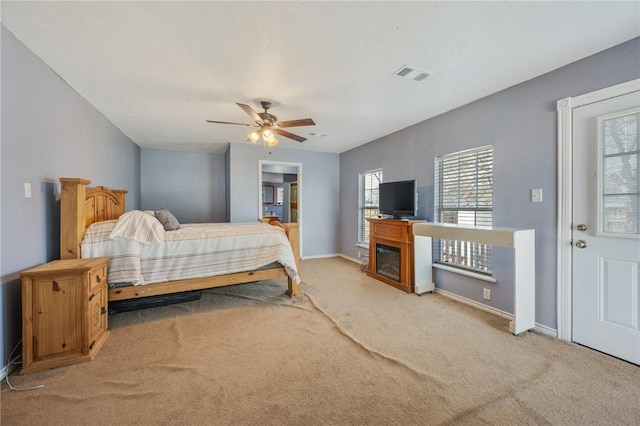 carpeted bedroom featuring ceiling fan