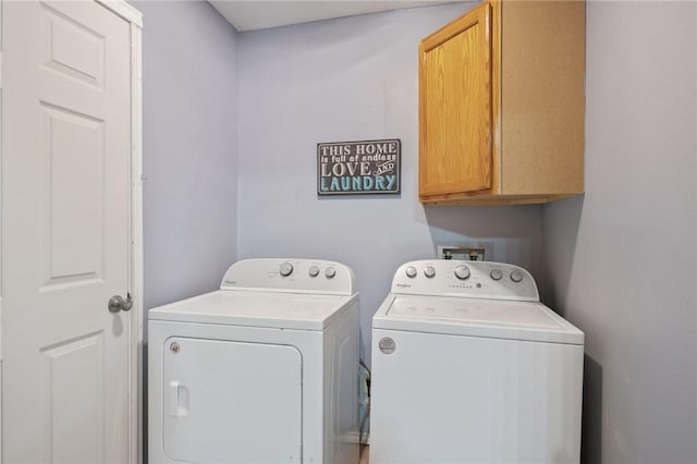 laundry room with cabinets and independent washer and dryer