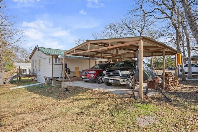 view of parking / parking lot with a lawn and a carport