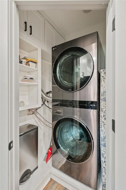 laundry room with laundry area and stacked washing maching and dryer