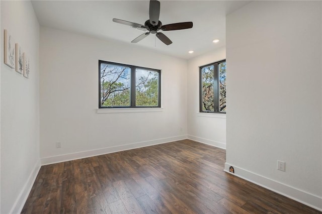 unfurnished room with dark wood-style floors, ceiling fan, recessed lighting, and baseboards