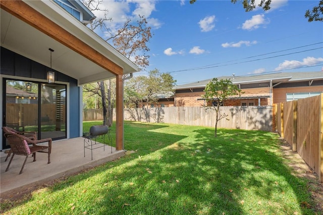 view of yard featuring a patio area and a fenced backyard