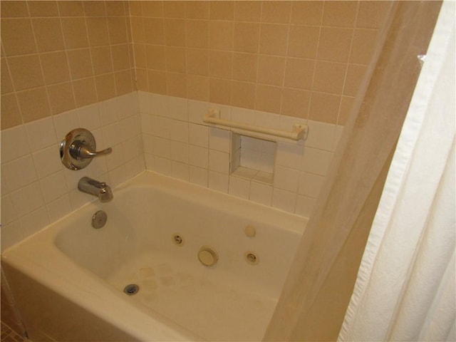 bathroom featuring a combined bath / shower with jetted tub