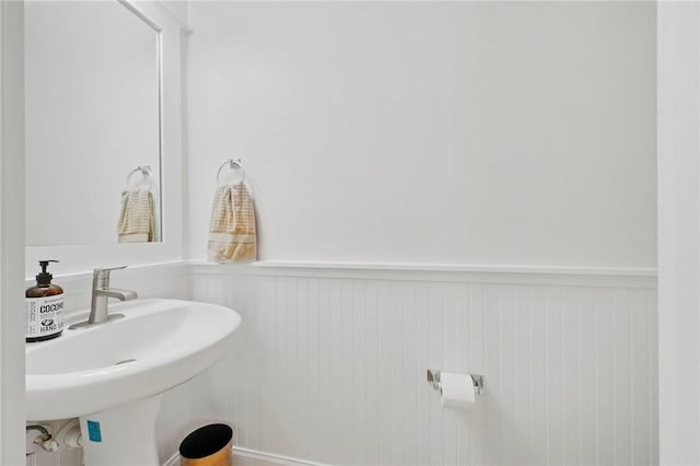 1725 Harvey Mitchell Pkwy, College Station, TX 77840 - bathroom with wainscoting and a sink