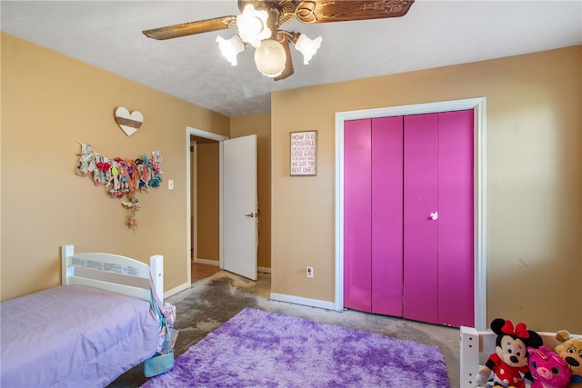 9777 Deer Trail Run, Hearne, TX 77859 - carpeted bedroom featuring a ceiling fan and a closet
