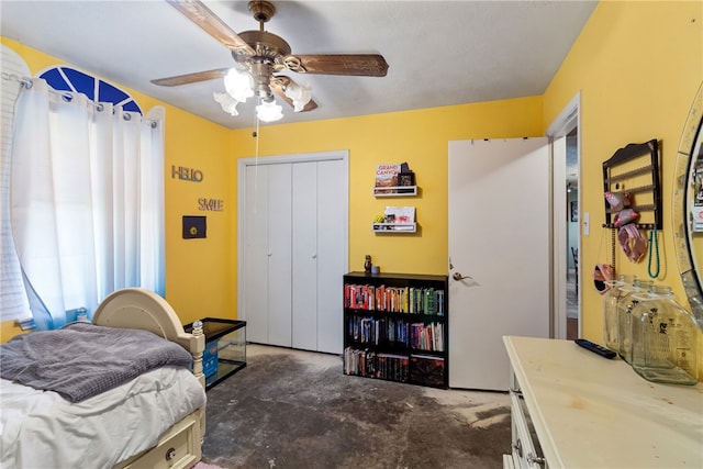 9777 Deer Trail Run, Hearne, TX 77859 - bedroom featuring concrete floors, a closet, and a ceiling fan