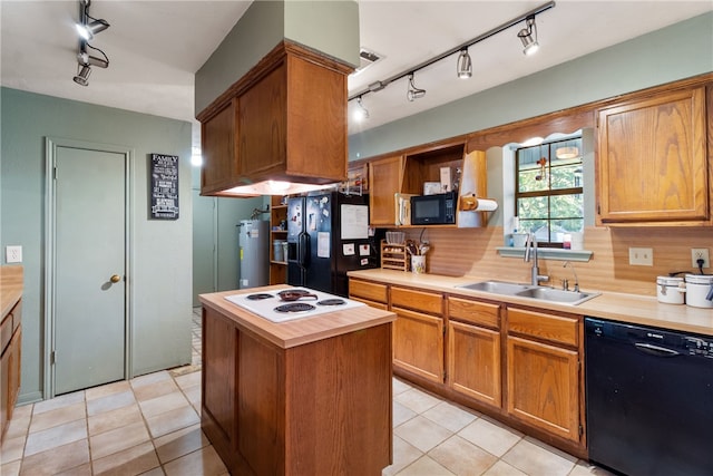 9777 Deer Trail Run, Hearne, TX 77859 - kitchen featuring black appliances, rail lighting, light countertops, open shelves, and light tile patterned flooring