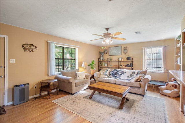 9777 Deer Trail Run, Hearne, TX 77859 - living area with light wood-style flooring and a ceiling fan