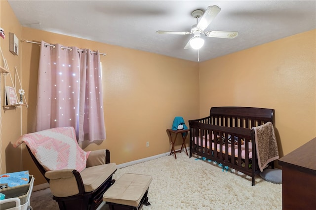 9777 Deer Trail Run, Hearne, TX 77859 - carpeted bedroom featuring baseboards and ceiling fan