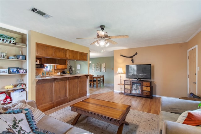 9777 Deer Trail Run, Hearne, TX 77859 - living room with light wood-type flooring and ceiling fan