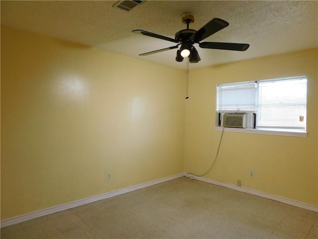 unfurnished room with ceiling fan and cooling unit