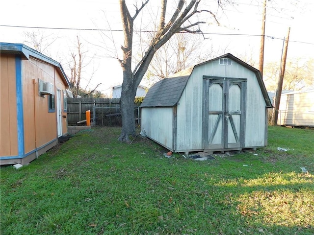 view of outbuilding with a yard