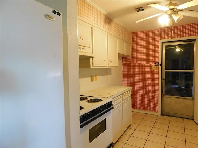 kitchen featuring white cabinets, white appliances, ceiling fan, and light tile patterned flooring