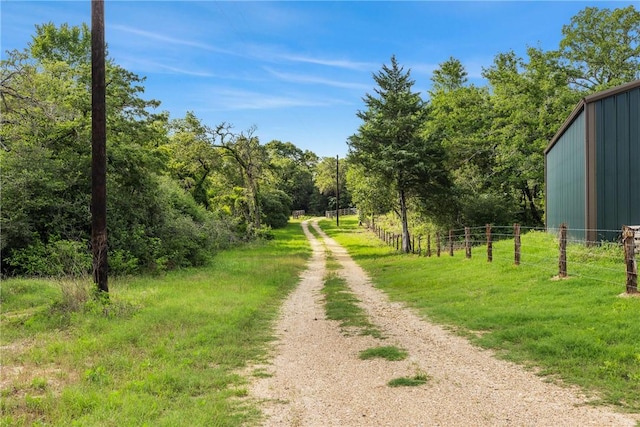 3205 County Road 308, Caldwell, TX 77836 - view of road featuring a wooded view