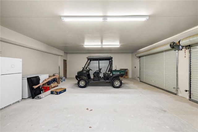 3205 County Road 308, Caldwell, TX 77836 - garage featuring freestanding refrigerator