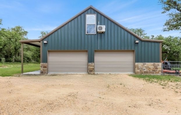 3205 County Road 308, Caldwell, TX 77836 - detached garage with driveway and ac unit