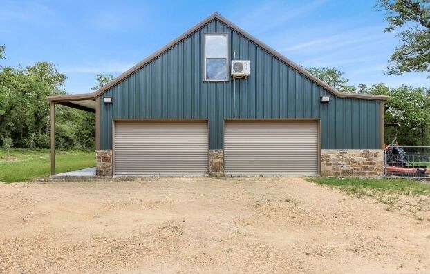 3205 County Road 308, Caldwell, TX 77836 - detached garage with driveway and ac unit