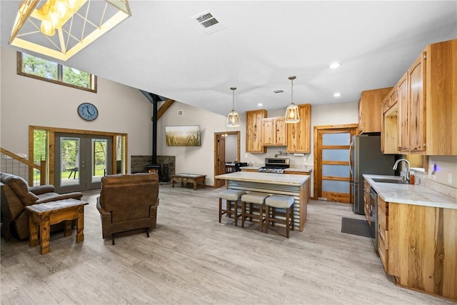 3205 County Road 308, Caldwell, TX 77836 - kitchen with a wood stove, range, open floor plan, healthy amount of natural light, and recessed lighting