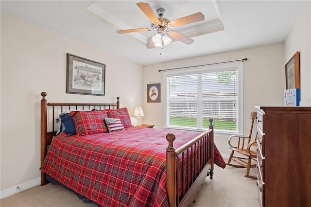 bedroom featuring baseboards, ceiling fan, and light carpet