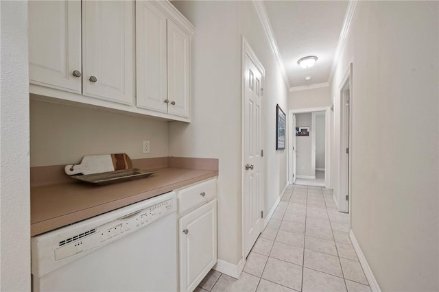 hall featuring crown molding, baseboards, and light tile patterned flooring