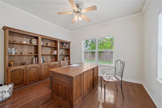 office area with baseboards, ornamental molding, a ceiling fan, and dark wood finished floors