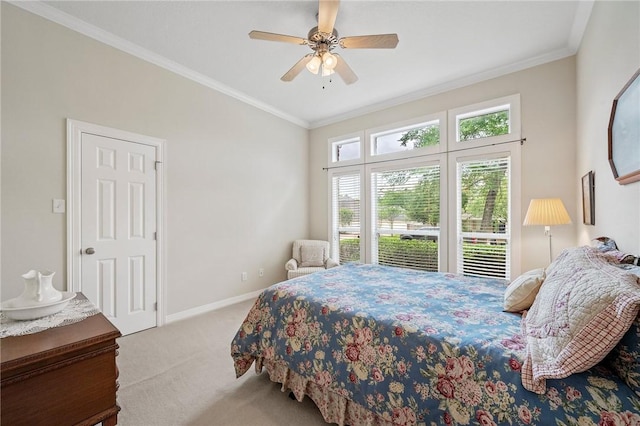 carpeted bedroom featuring baseboards, ornamental molding, and a ceiling fan