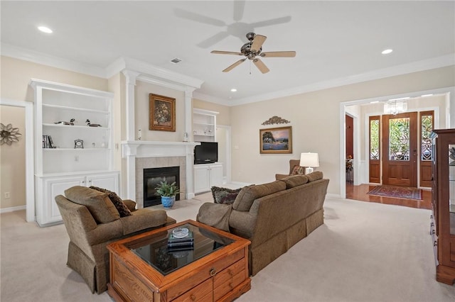 living room with ornamental molding, a fireplace, recessed lighting, and ceiling fan