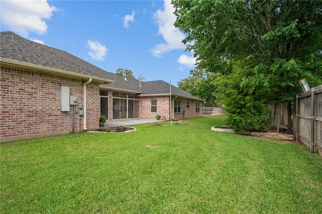 view of yard with a fenced backyard and a patio area