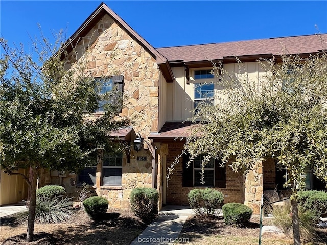 128 Kimber Ln, College Station, TX 77845 - view of front of house featuring stone siding and a shingled roof