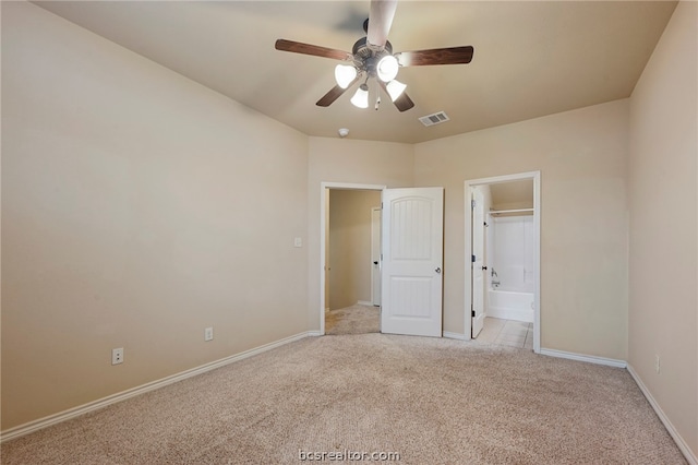128 Kimber Ln, College Station, TX 77845 - unfurnished bedroom with light colored carpet, baseboards, ensuite bath, and ceiling fan