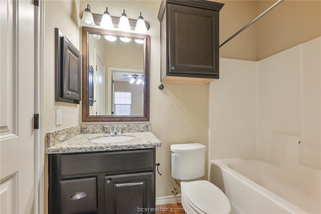 128 Kimber Ln, College Station, TX 77845 - bathroom with vanity, toilet, bathing tub / shower combination, and baseboards