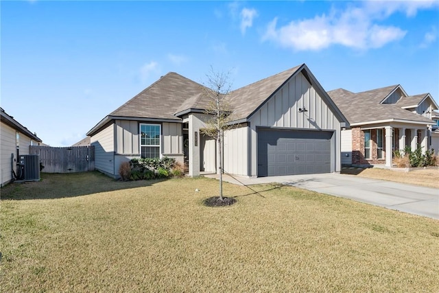 modern farmhouse featuring central air condition unit, board and batten siding, a garage, driveway, and a front lawn