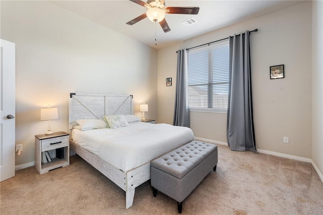 bedroom featuring light carpet, a ceiling fan, visible vents, and baseboards