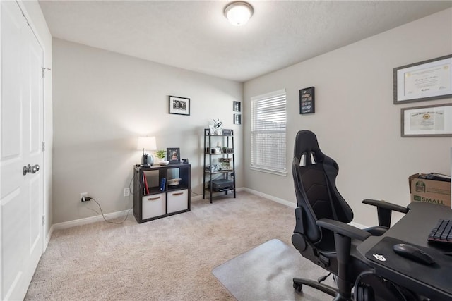 home office featuring baseboards and carpet flooring