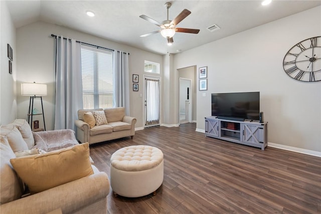 living area with dark wood-style floors, a ceiling fan, visible vents, and baseboards