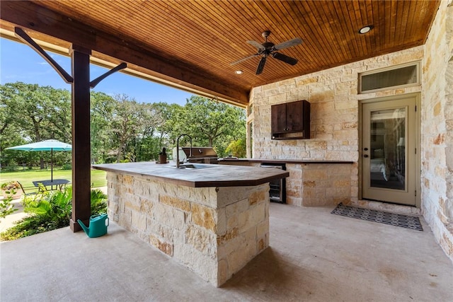 18265 Windmill Ct, College Station, TX 77845 - view of patio / terrace with an outdoor kitchen, ceiling fan, and beverage cooler